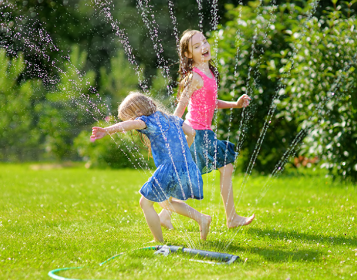 Children Playing in Water Backyard